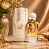 Soghaat RiiFFS Taif Extrait de Parfum bottle with gold octopus-like tentacles and white cap next to its matching box.