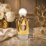 Soghaat RiiFFS Taif Extrait de Parfum in a unique gold octopus-themed bottle with a white cap on a marble surface.