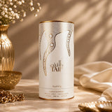 Soghaat RiiFFS Taif 100ml Extrait de Parfum in a cylindrical white and gold bottle on a marble surface.