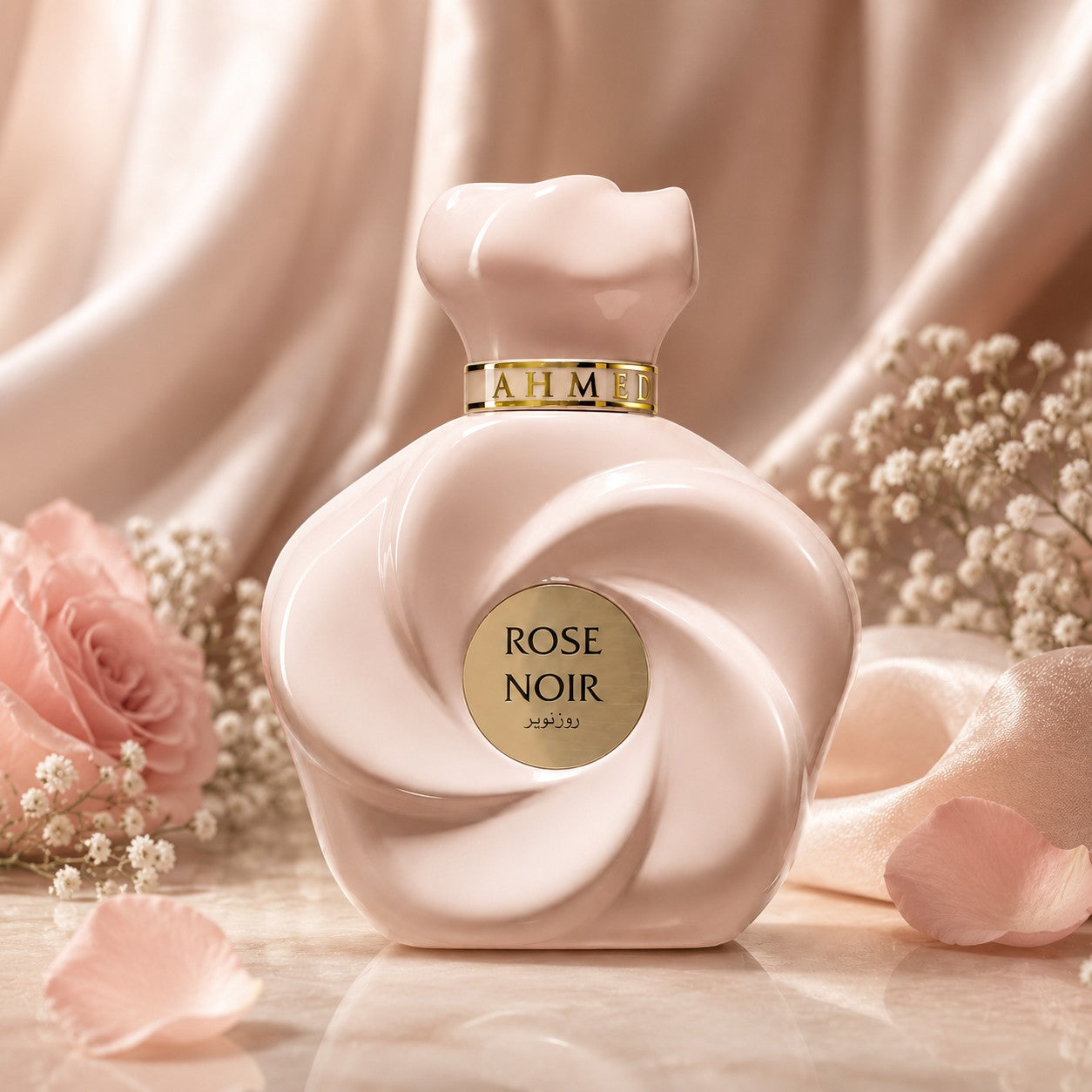 Soghaat Rose Noir Extrait de Parfum in a sculptural pale pink bottle, surrounded by soft roses and silk fabric.
