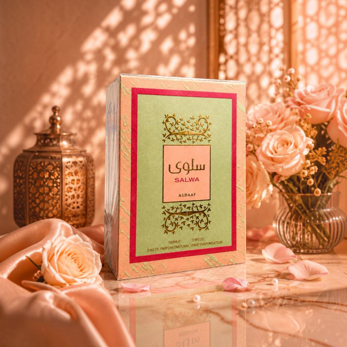 Soghaat Salwa by Asdaaf 100ml Eau de Parfum box with floral accents, displayed with roses and a lantern.