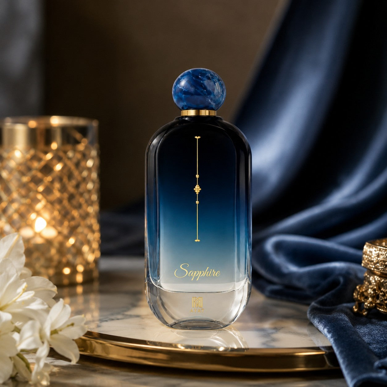 Ahmed Al Maghribi Sapphire Eau de Parfum bottle with blue gradient glass and gold accents. Fresh woody aromatic scent.