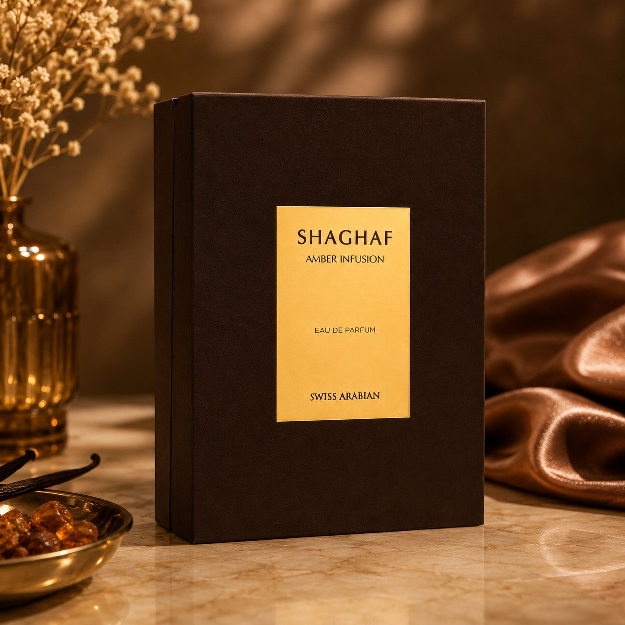 Soghaat Swiss Arabian Shaghaf Amber Infusion Eau de Parfum box with gold label on a warm, elegant display surface.
