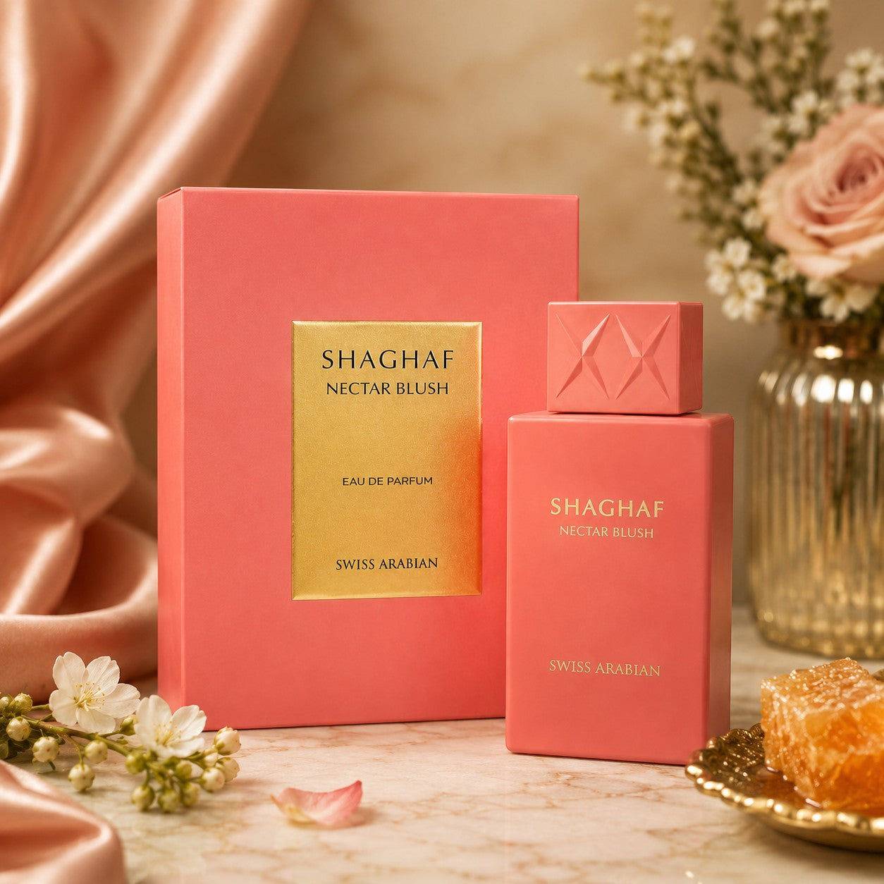 Soghaat Swiss Arabian Shaghaf Nectar Blush Eau de Parfum bottle and box in coral pink with gold accents