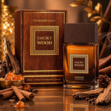 Soghaat Smoky Wood Extrait de Parfum bottle and box with cinnamon, amber, and wood accents on a reflective surface.