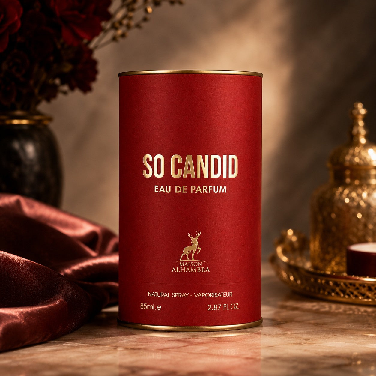 Soghaat Maison Alhambra So Candid 85ml Eau de Parfum in a red cylindrical bottle with gold lettering and logo.