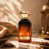 Soghaat Ahmed Al Maghribi Summer Oud Eau de Parfum in a gradient amber glass bottle with a gold cap on a marble surface.