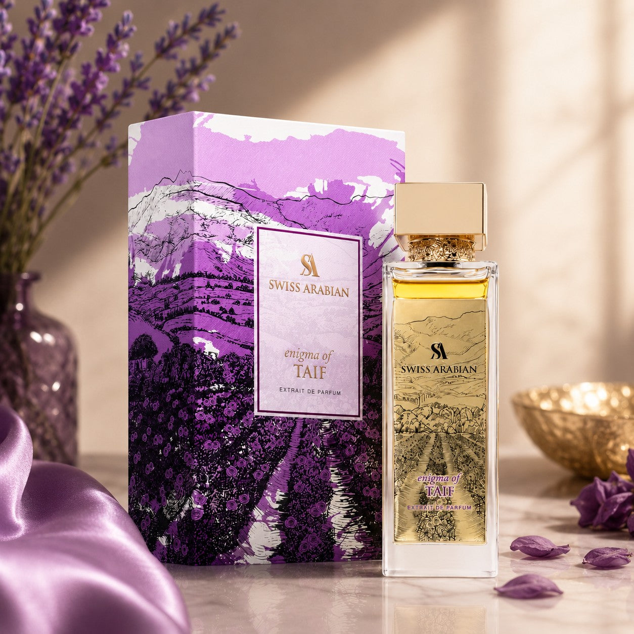 Soghaat Swiss Arabian Enigma of Taif Extrait de Parfum bottle and purple illustrated box on a table with lavender.