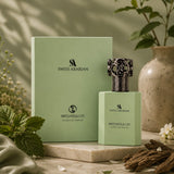 Soghaat Swiss Arabian Patchouli 01 Extrait de Parfum bottle and box in a soft green setting with botanical accents.