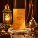 Soghaat Tonka Gold by Atralia 100ml Eau de Parfum in a gold box on a marble stand with Arabian lanterns and dates.