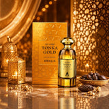 Soghaat Tonka Gold by Atralia 100ml Eau de Parfum bottle and gold box with warm Arabian-style lantern decor.