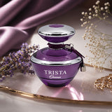 Soghaat Dumont Paris Trista Queen Eau de Parfum in a deep purple glass bottle with silver accents on a vanity tray.