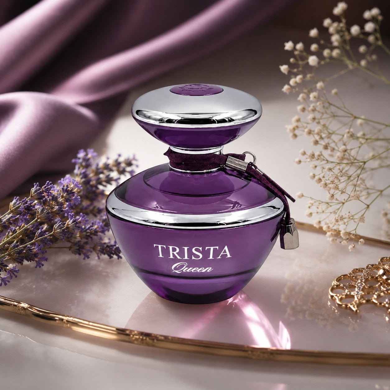 Soghaat Dumont Paris Trista Queen Eau de Parfum in a deep purple glass bottle with silver accents on a vanity tray.