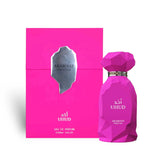 Soghaat Uhud 100ml Eau de Parfum in a vibrant pink geometric bottle and matching box. Sweet amber gourmand fragrance.