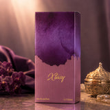 Soghaat Xtasy 100ml Eau de Parfum for unisex, fresh oud woody fragrance with purple watercolor design.