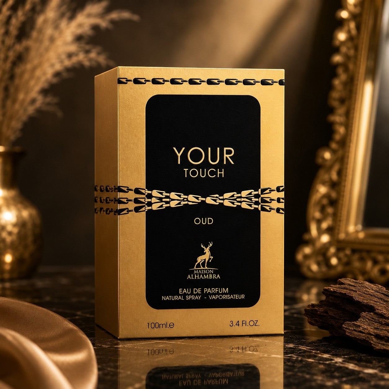 Soghaat Maison Alhambra Your Touch Oud Eau de Parfum 100ml bottle in a gold and black box on a dark marble surface.