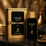 Soghaat Maison Alhambra Your Touch Oud Eau de Parfum 100ml bottle and gold box on a dark marble surface