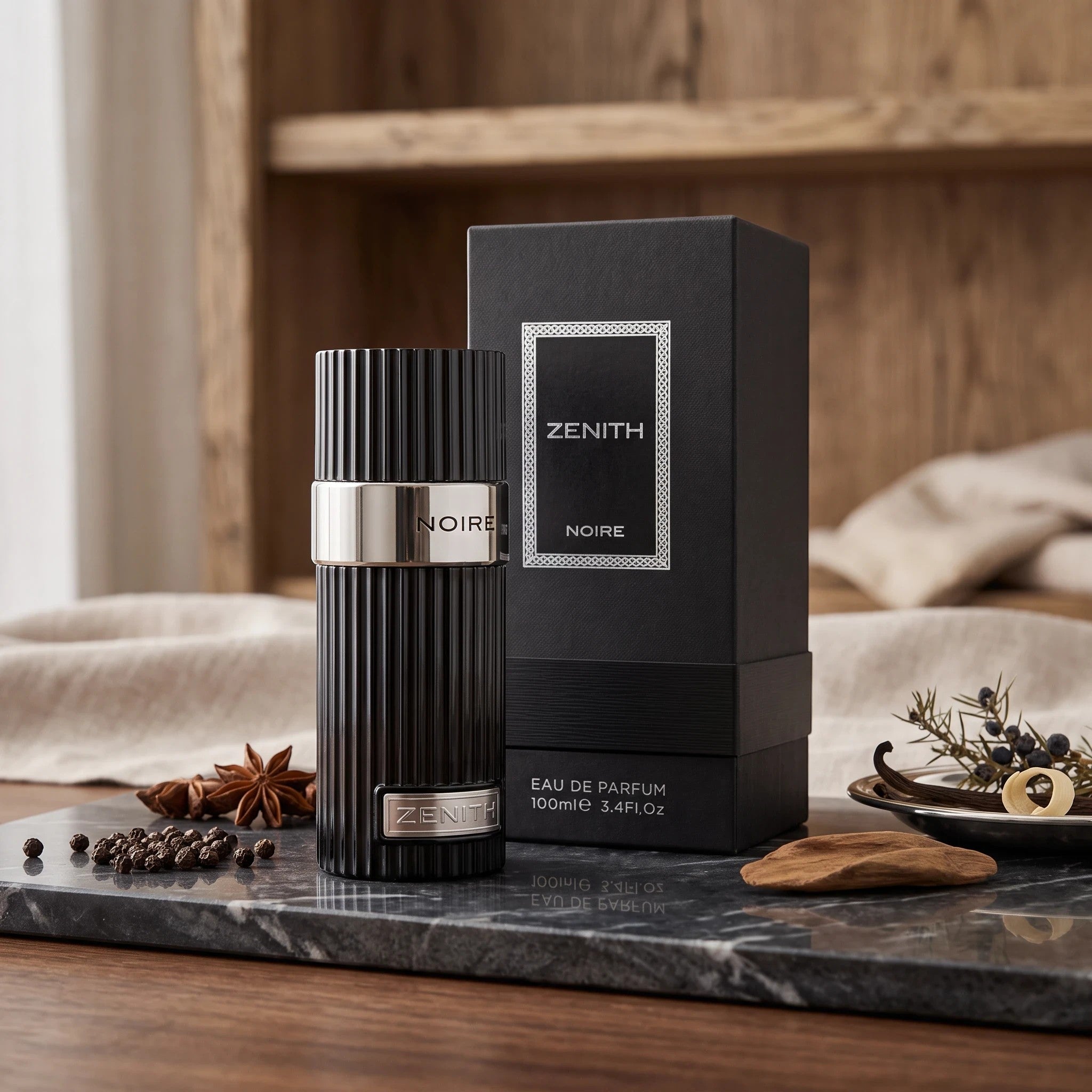 Soghaat Zenith Noire Eau de Parfum bottle and box on a marble tray with incense and spices for a woody scent.