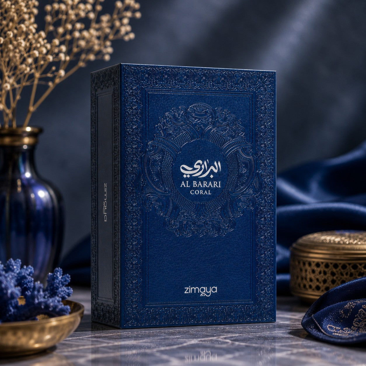 Soghaat Zimaya AL Barari Coral Eau de Parfum in a textured blue box with ornate gold embossed details.