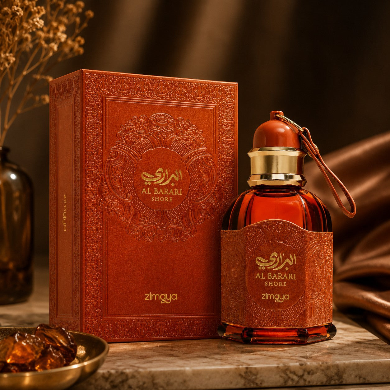 Soghaat Zimaya AL Barari Shore Eau de Parfum bottle and ornate orange box on a marble surface with warm lighting.