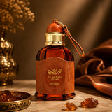 Soghaat Zimaya AL Barari Shore Eau de Parfum in an amber glass bottle with leather-textured label and gold cap.