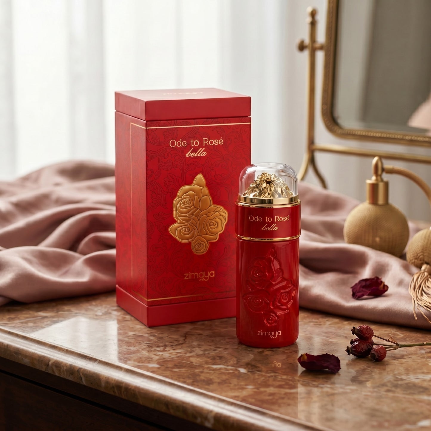 Soghaat Zimaya Ode to Rose Bella 100ml Eau de Parfum bottle and red box on a marble vanity with rose petals.