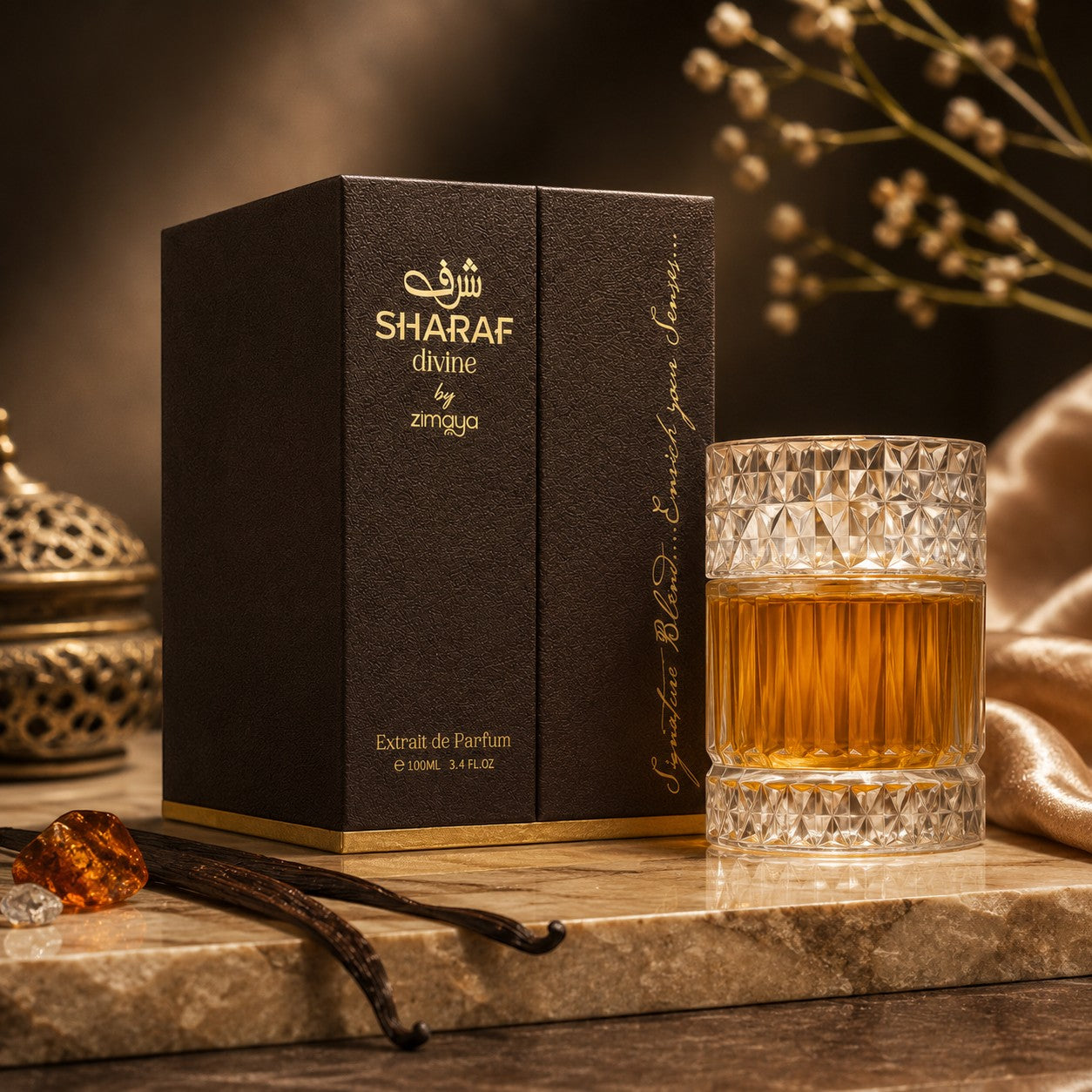 Soghaat Zimaya Sharaf Divine Eau de Parfum bottle and box with vanilla beans and amber on a marble surface.
