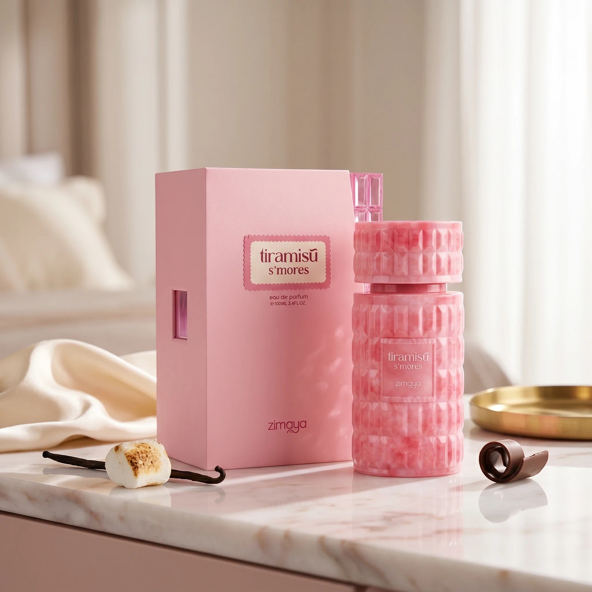 Soghaat Zimaya Tiramisu S'mores 100ml Eau de Parfum in a pink textured bottle and box with marshmallow and chocolate.